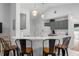 Kitchen featuring a breakfast bar with seating, white countertops, and stainless steel appliances at 7764 Indian Ridge N Trl, Kissimmee, FL 34747
