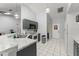 Well-lit kitchen featuring a breakfast bar and modern appliances at 7764 Indian Ridge N Trl, Kissimmee, FL 34747