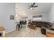 Open-concept living room showcasing modern flooring, and a cozy seating area at 7764 Indian Ridge N Trl, Kissimmee, FL 34747