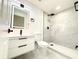 Updated bathroom featuring new lighting, vanity, and walk-in shower with black fixtures at 817 Clay Blvd, Eustis, FL 32726