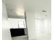Modern kitchen features sleek, gray cabinetry, quartz countertops, and a view into the living room at 817 Clay Blvd, Eustis, FL 32726