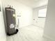 Updated laundry area with new water heater and new flooring at 817 Clay Blvd, Eustis, FL 32726