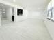 Spacious living room with light wood floors seamlessly flowing into the kitchen, with an open and airy layout at 817 Clay Blvd, Eustis, FL 32726