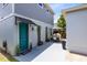 Back of the house featuring a private patio, outdoor seating, and access to a detached garage at 8290 Nemours Pkwy, Orlando, FL 32827
