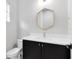Stylish half-bathroom featuring a designer mirror and modern fixtures at 8290 Nemours Pkwy, Orlando, FL 32827