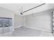 Clean garage with epoxy floors, a door to the house, and a modern garage door at 8290 Nemours Pkwy, Orlando, FL 32827