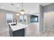 Bright and airy living space, featuring an island and plenty of natural light at 8290 Nemours Pkwy, Orlando, FL 32827