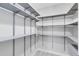 Walk-in pantry with adjustable shelving, maximizing storage and organization space at 8290 Nemours Pkwy, Orlando, FL 32827