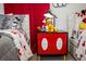 Themed bedroom decor with Mickey Mouse-themed bedding, furniture, and playful accents for a fun, -friendly space at 9071 Sunshine Ridge Loop, Kissimmee, FL 34747