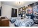 Unique bedroom featuring a city themed mural wall, twin beds, and modern furnishings at 9071 Sunshine Ridge Loop, Kissimmee, FL 34747