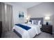 Well-lit bedroom features neutral tones, soft carpet, and coordinated furniture, providing a serene space at 9071 Sunshine Ridge Loop, Kissimmee, FL 34747
