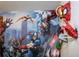 Detailed close-up of Avengers-themed 3D wall decor and character designs in bedroom at 9071 Sunshine Ridge Loop, Kissimmee, FL 34747