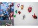 Cool bedroom featuring unique Avengers wall decor and colorful character designs at 9071 Sunshine Ridge Loop, Kissimmee, FL 34747