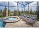 Inviting outdoor hot tub with lounge chairs perfect for relaxation and enjoying the beautiful weather at 9071 Sunshine Ridge Loop, Kissimmee, FL 34747