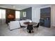 Charming living room with a mini bar, dining area, and comfortable seating arrangements at 9071 Sunshine Ridge Loop, Kissimmee, FL 34747