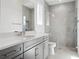 Modern bathroom featuring a glass-enclosed shower and a large vanity at 9156 Sheen Sound St, Orlando, FL 32836
