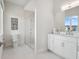 Modern bathroom with a glass shower and a bright white vanity at 9156 Sheen Sound St, Orlando, FL 32836