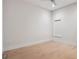 Empty bedroom with hardwood floors, a single window, and neutral decor at 9156 Sheen Sound St, Orlando, FL 32836