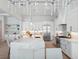 Bright kitchen with a marble countertop island, stainless steel appliances, and modern cabinets and lighting at 9156 Sheen Sound St, Orlando, FL 32836