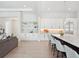 Open-concept kitchen with marble countertops, seating, built-in shelving, and stainless steel appliances at 9156 Sheen Sound St, Orlando, FL 32836