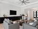 Open living room featuring large TV and comfortable seating perfect for gatherings at 9156 Sheen Sound St, Orlando, FL 32836