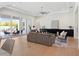 Inviting living room with outdoor access, sleek furniture, and plenty of natural light at 9156 Sheen Sound St, Orlando, FL 32836