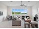 Bright living room featuring large windows and stylish furnishings at 9156 Sheen Sound St, Orlando, FL 32836