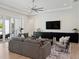 Open living room with modern decor and view of open concept kitchen, great for entertaining guests at 9156 Sheen Sound St, Orlando, FL 32836