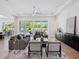 Spacious living room with modern decor, recessed lighting, and sliding glass doors to the outdoor area at 9156 Sheen Sound St, Orlando, FL 32836