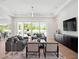 Open living room with modern decor, and sliding glass doors that provide abundant natural light at 9156 Sheen Sound St, Orlando, FL 32836
