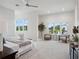 Bright main bedroom with large windows and sitting area with stylish decor at 9156 Sheen Sound St, Orlando, FL 32836