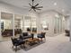 Covered patio with comfortable seating and views into the home's interior at 9156 Sheen Sound St, Orlando, FL 32836