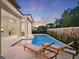 Relaxing pool area with chaise lounges and elegant landscaping, perfect for outdoor enjoyment at 9156 Sheen Sound St, Orlando, FL 32836