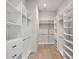 Large walk-in closet featuring custom storage solutions at 9156 Sheen Sound St, Orlando, FL 32836