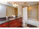Bathroom featuring double sinks, granite counters, and a shower-tub combination at 101 S Eola Dr # 1021, Orlando, FL 32801