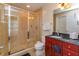 Bathroom featuring glass enclosed shower and granite topped vanity at 101 S Eola Dr # 1021, Orlando, FL 32801