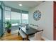 Dining area with wood floors, a dining table set, and large windows with city views at 101 S Eola Dr # 1021, Orlando, FL 32801