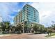 Stunning high rise with floor to ceiling glass windows and manicured landscaping at 101 S Eola Dr # 1021, Orlando, FL 32801
