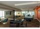 Stylish lounge area with a TV, pool table, comfortable seating and warm, inviting lighting at 101 S Eola Dr # 1021, Orlando, FL 32801