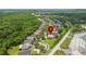 Aerial view of house in community with mature trees, near SR 417 and Medical City at 10142 Serotina Ct, Orlando, FL 32832
