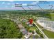 Aerial view of house in community with mature trees, near SR 417 and Moss Park Elementary at 10142 Serotina Ct, Orlando, FL 32832