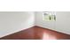 Bedroom features hardwood floors and a window providing natural light at 10142 Serotina Ct, Orlando, FL 32832