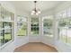 Bright breakfast nook with windows overlooking landscaped backyard at 10142 Serotina Ct, Orlando, FL 32832