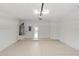 Spacious two-car garage featuring painted walls, epoxy floor, and water heater at 10142 Serotina Ct, Orlando, FL 32832