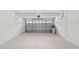 Clean, epoxy-coated two car garage with overhead storage at 10142 Serotina Ct, Orlando, FL 32832