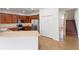 Well-lit kitchen with stainless steel appliances, wooden cabinets, and a breakfast bar at 10142 Serotina Ct, Orlando, FL 32832