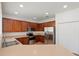 Modern kitchen with stainless steel appliances and ample cabinet space at 10142 Serotina Ct, Orlando, FL 32832