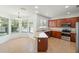 Well-lit kitchen featuring modern appliances and adjacent breakfast nook at 10142 Serotina Ct, Orlando, FL 32832