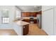 Modern kitchen features stainless steel appliances, breakfast bar, and ample cabinetry at 10142 Serotina Ct, Orlando, FL 32832