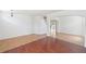 Spacious living room showcasing hardwood floors and archways at 10142 Serotina Ct, Orlando, FL 32832